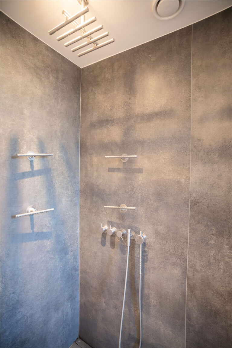 a shower with a few faucets